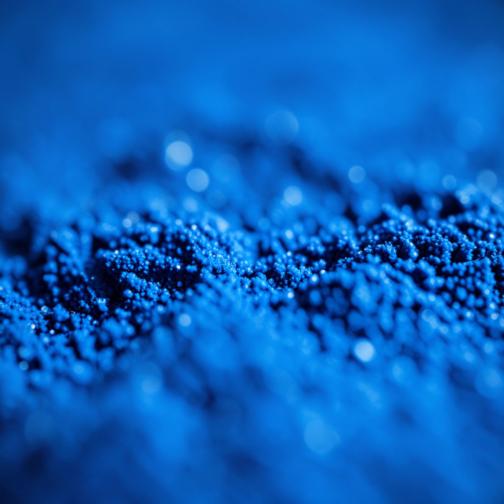 Close-up of glossy film reel texture in dark blue and black tones